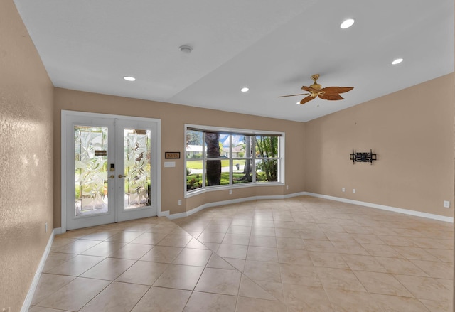 1070 SW Jennifer Ter, Port Saint Lucie, FL 34953 - spare room featuring ceiling fan, french doors, light tile patterned floors, recessed lighting, and lofted ceiling