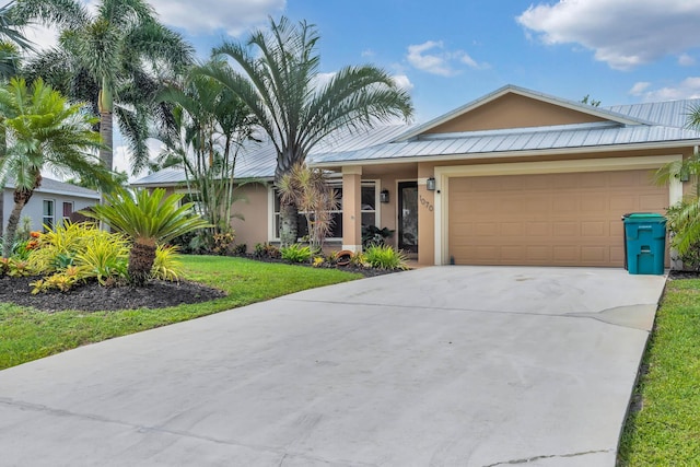 1070 SW Jennifer Ter, Port Saint Lucie, FL 34953 - ranch-style home featuring stucco siding, a metal roof, a garage, and concrete driveway