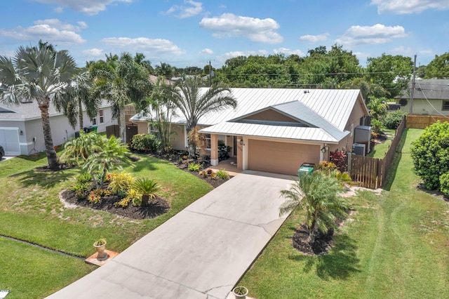 1070 SW Jennifer Ter, Port Saint Lucie, FL 34953 - single story home featuring concrete driveway, an attached garage, a metal roof, and stucco siding