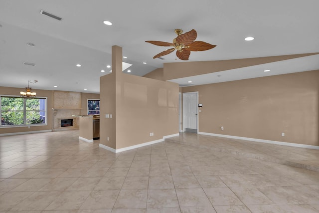 1070 SW Jennifer Ter, Port Saint Lucie, FL 34953 - unfurnished living room with a ceiling fan, light tile patterned flooring, recessed lighting, a chandelier, and vaulted ceiling