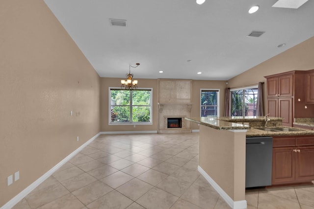 1070 SW Jennifer Ter, Port Saint Lucie, FL 34953 - kitchen with dishwasher, plenty of natural light, open floor plan, a fireplace, and recessed lighting