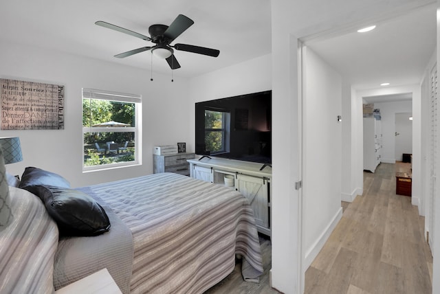 2626 Garfield St, Hollywood, FL 33020 - bedroom with light wood finished floors, ceiling fan, and recessed lighting