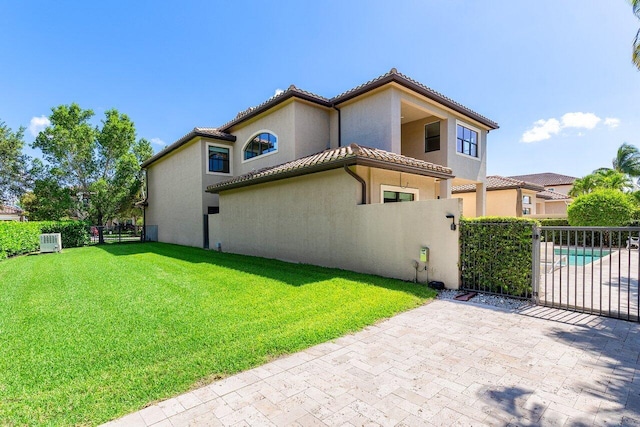 8199 Lost Creek Ln, Delray Beach, FL 33446 - view of side of property featuring stucco siding, a tile roof, and a patio area