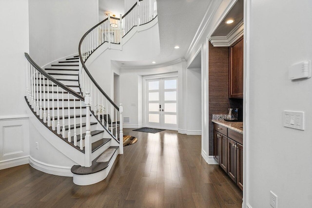 8199 Lost Creek Ln, Delray Beach, FL 33446 - foyer with french doors, stairs, crown molding, and dark wood-style flooring