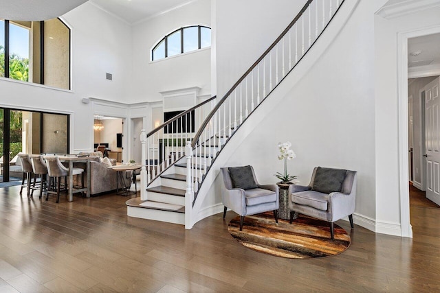 8199 Lost Creek Ln, Delray Beach, FL 33446 - foyer entrance featuring wood finished floors, ornamental molding, stairway, and a towering ceiling