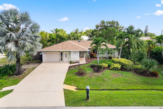 1107 SE Cambridge Dr, Port Saint Lucie, FL 34952 - single story home featuring an attached garage, a front lawn, and driveway
