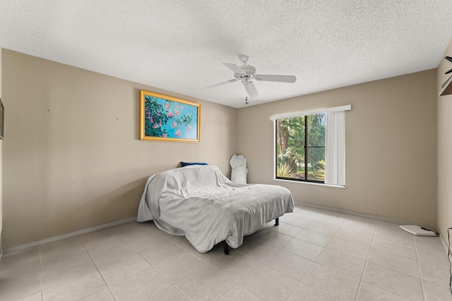 1107 SE Cambridge Dr, Port Saint Lucie, FL 34952 - bedroom featuring a textured ceiling, a ceiling fan, and light tile patterned flooring