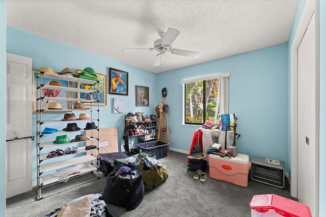 1107 SE Cambridge Dr, Port Saint Lucie, FL 34952 - game room with carpet floors, ceiling fan, and a textured ceiling