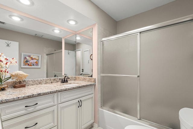 1107 SE Cambridge Dr, Port Saint Lucie, FL 34952 - bathroom with vanity, enclosed tub / shower combo, and recessed lighting