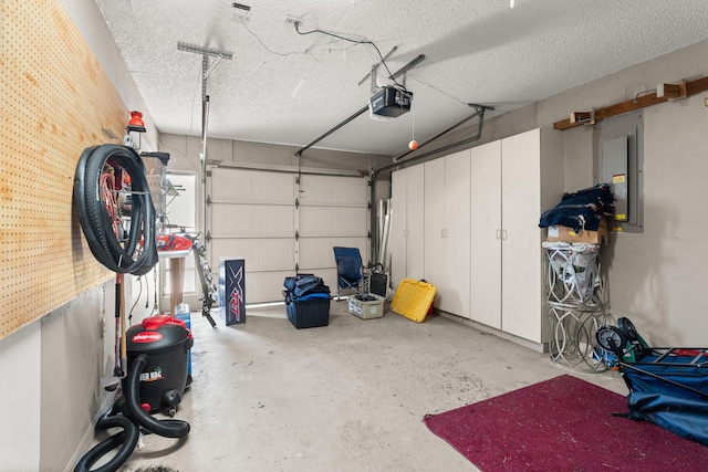 1107 SE Cambridge Dr, Port Saint Lucie, FL 34952 - garage with electric panel and a garage door opener
