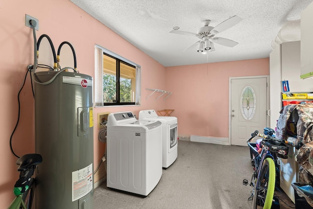 1107 SE Cambridge Dr, Port Saint Lucie, FL 34952 - washroom with water heater, separate washer and dryer, ceiling fan, light carpet, and a textured ceiling
