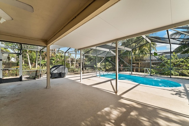 1107 SE Cambridge Dr, Port Saint Lucie, FL 34952 - outdoor pool with a patio area, glass enclosure, a fenced backyard, and grilling area