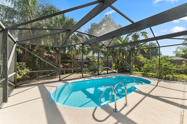 1107 SE Cambridge Dr, Port Saint Lucie, FL 34952 - view of pool featuring a patio, a lanai, and a fenced backyard