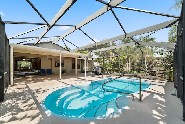 1107 SE Cambridge Dr, Port Saint Lucie, FL 34952 - swimming pool with a patio area, ceiling fan, and a lanai