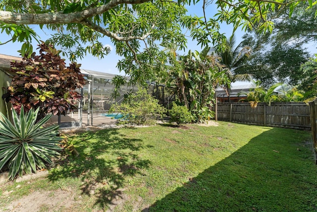 1107 SE Cambridge Dr, Port Saint Lucie, FL 34952 - fenced backyard featuring glass enclosure