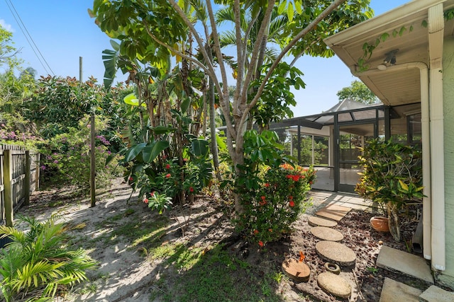 1107 SE Cambridge Dr, Port Saint Lucie, FL 34952 - view of yard with glass enclosure and a patio