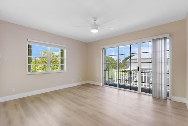 401 Vision Ct, Palm Beach Gardens, FL 33418 - empty room with wood finished floors and a ceiling fan