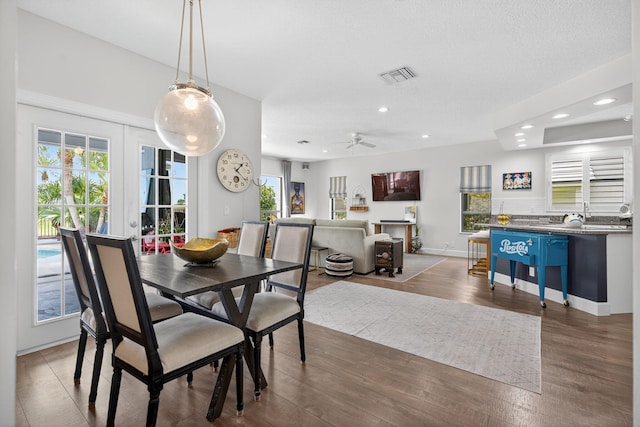 31 Dunbar Rd, Palm Beach Gardens, FL 33418 - dining area featuring wood finished floors, ceiling fan, and recessed lighting
