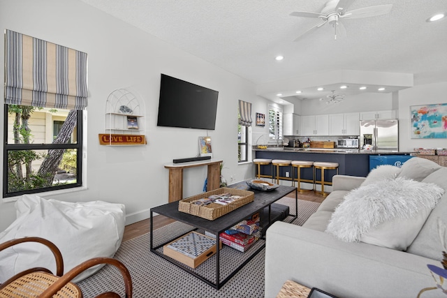 31 Dunbar Rd, Palm Beach Gardens, FL 33418 - living room featuring recessed lighting, wood finished floors, a ceiling fan, and a textured ceiling