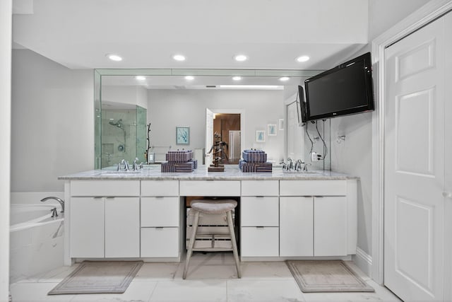 31 Dunbar Rd, Palm Beach Gardens, FL 33418 - bathroom with a marble finish shower, double vanity, a garden tub, recessed lighting, and marble finish floors