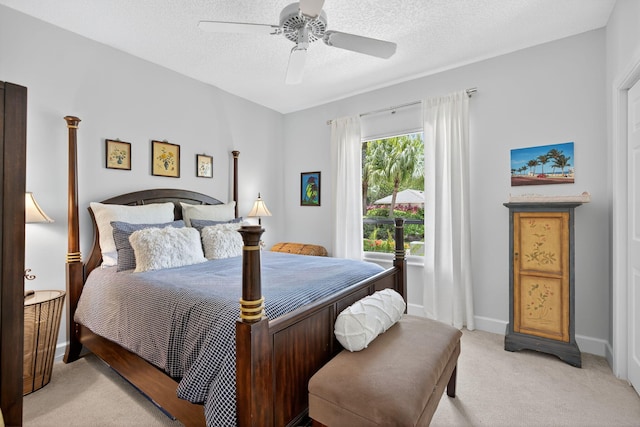 31 Dunbar Rd, Palm Beach Gardens, FL 33418 - bedroom featuring light colored carpet, a textured ceiling, and ceiling fan