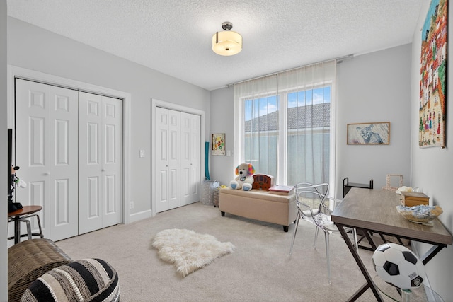31 Dunbar Rd, Palm Beach Gardens, FL 33418 - living area featuring carpet flooring and a textured ceiling