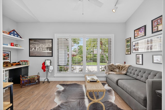 31 Dunbar Rd, Palm Beach Gardens, FL 33418 - living room with a ceiling fan, wood finished floors, and track lighting