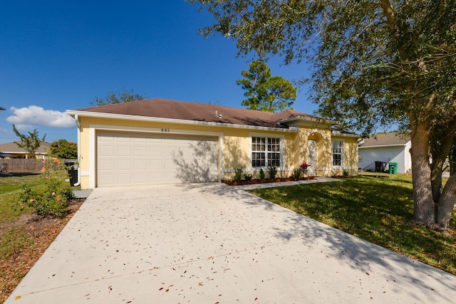 885 SW Sultan Dr, Port Saint Lucie, FL 34953 - ranch-style home with driveway, a garage, stucco siding, and a front lawn