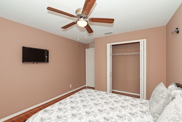 885 SW Sultan Dr, Port Saint Lucie, FL 34953 - bedroom with wood finished floors, a closet, and ceiling fan