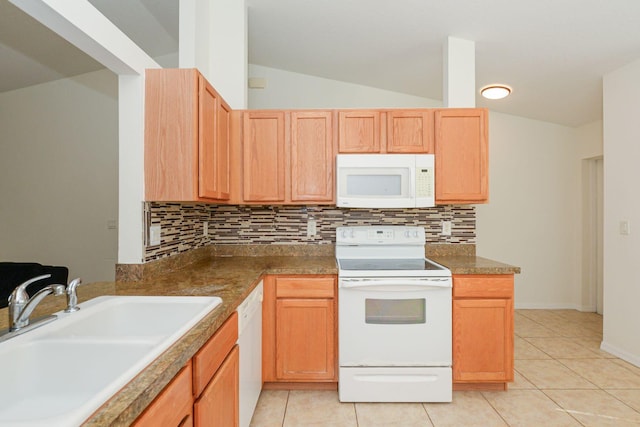 885 SW Sultan Dr, Port Saint Lucie, FL 34953 - kitchen with white appliances, decorative backsplash, lofted ceiling, light tile patterned floors, and light brown cabinets