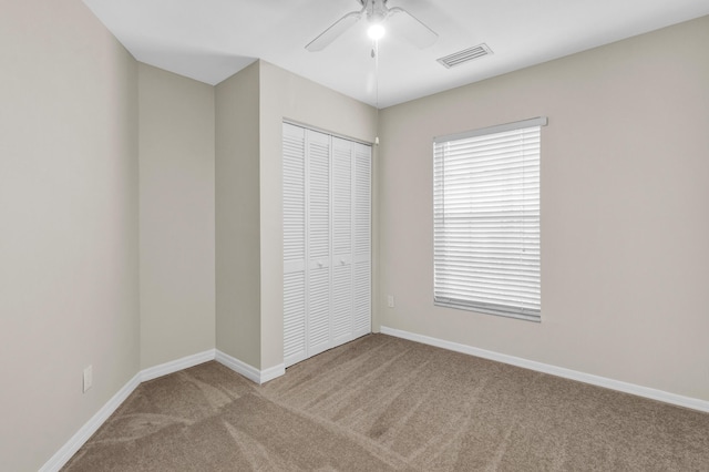 1360 39th Ave, Vero Beach, FL 32960 - unfurnished bedroom featuring carpet floors, a closet, and a ceiling fan