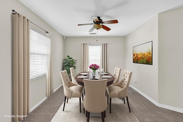 1360 39th Ave, Vero Beach, FL 32960 - carpeted dining area featuring a ceiling fan and baseboards