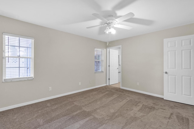1360 39th Ave, Vero Beach, FL 32960 - unfurnished bedroom with carpet floors and a ceiling fan