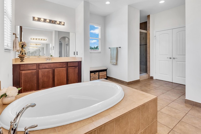 6458 SW Key Deer Ln, Palm City, FL 34990 - bathroom with a garden tub, vanity, a shower stall, tile patterned floors, and recessed lighting