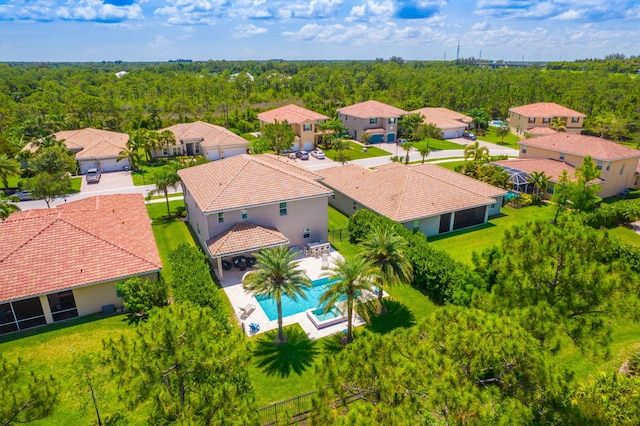 6458 SW Key Deer Ln, Palm City, FL 34990 - aerial view of residential area featuring a pool and a heavily wooded area