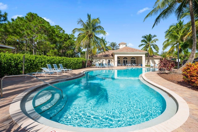6458 SW Key Deer Ln, Palm City, FL 34990 - community pool featuring a patio