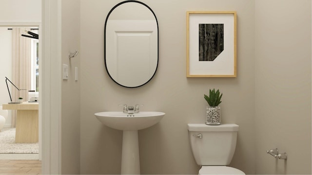1153 SE Crosswood Way, Port Saint Lucie, FL 34987 - bathroom featuring toilet and wood finished floors