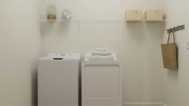 1153 SE Crosswood Way, Port Saint Lucie, FL 34987 - laundry room featuring separate washer and dryer and baseboards