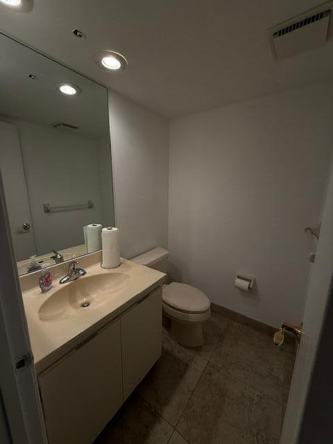 3510 Oaks Way Unit 103, Pompano Beach, FL 33069 - bathroom featuring vanity, recessed lighting, and tile patterned floors