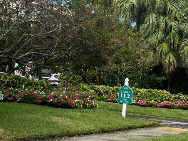 3510 Oaks Way Unit 103, Pompano Beach, FL 33069 - view of property's community with a lawn