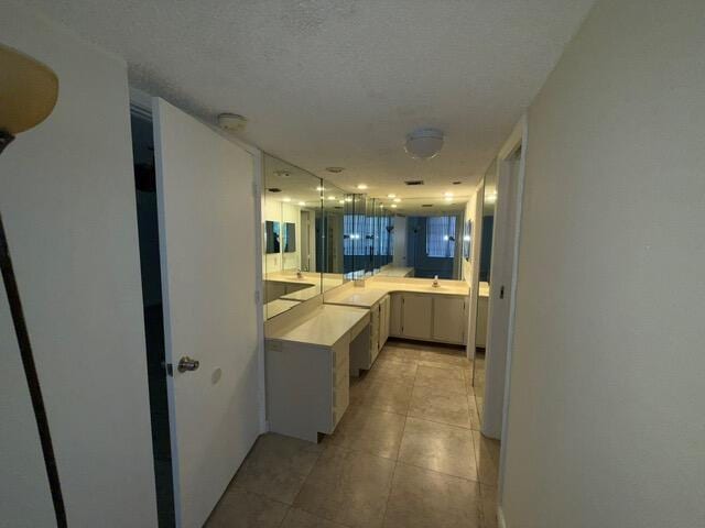 3510 Oaks Way Unit 103, Pompano Beach, FL 33069 - bathroom featuring tile patterned floors and a sink