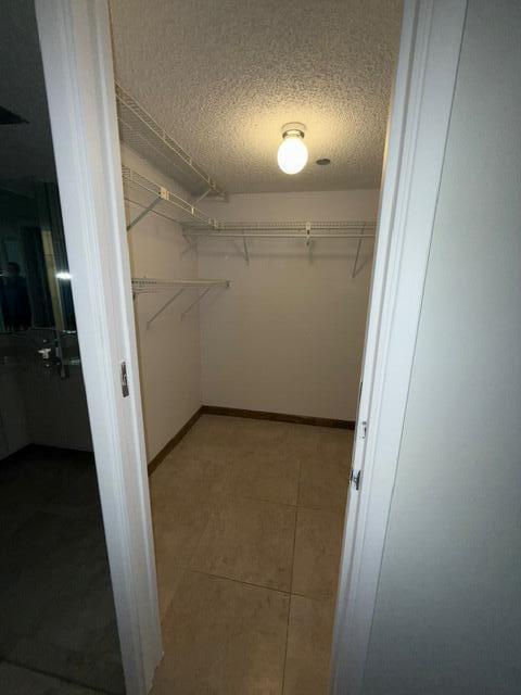 3510 Oaks Way Unit 103, Pompano Beach, FL 33069 - spacious closet with tile patterned floors