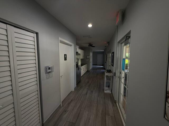3510 Oaks Way Unit 103, Pompano Beach, FL 33069 - hall featuring dark wood-type flooring and recessed lighting
