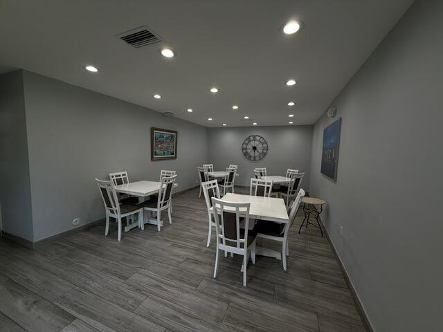 3510 Oaks Way Unit 103, Pompano Beach, FL 33069 - dining space featuring recessed lighting and wood finished floors