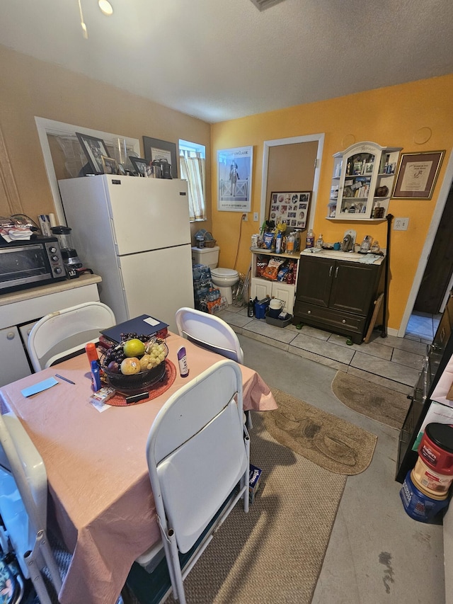 1408 SE 8th Dr, Okeechobee, FL 34974 - dining room with concrete flooring