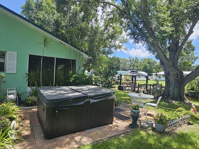 1408 SE 8th Dr, Okeechobee, FL 34974 - view of yard with a hot tub, a gazebo, and a patio area
