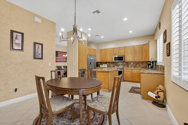 8275 Bob O Link Dr, West Palm Beach, FL 33412 - dining space with light tile patterned flooring, a chandelier, and recessed lighting
