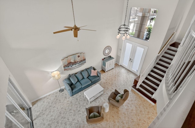8110 Brigamar Isles Ave, Boynton Beach, FL 33473 - living room featuring french doors, ceiling fan, and stairway