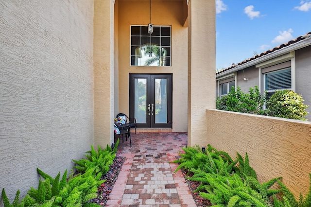 8110 Brigamar Isles Ave, Boynton Beach, FL 33473 - doorway to property featuring french doors and stucco siding