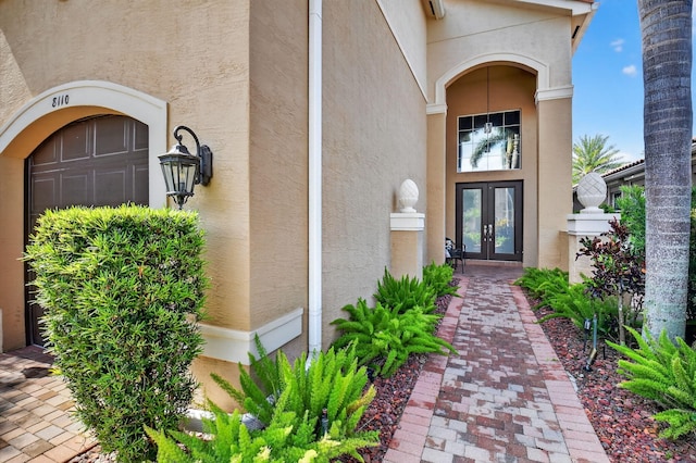 8110 Brigamar Isles Ave, Boynton Beach, FL 33473 - property entrance with french doors and stucco siding